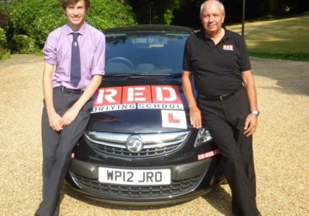 Tiff Needell and Harry leaning on RED car bonnet